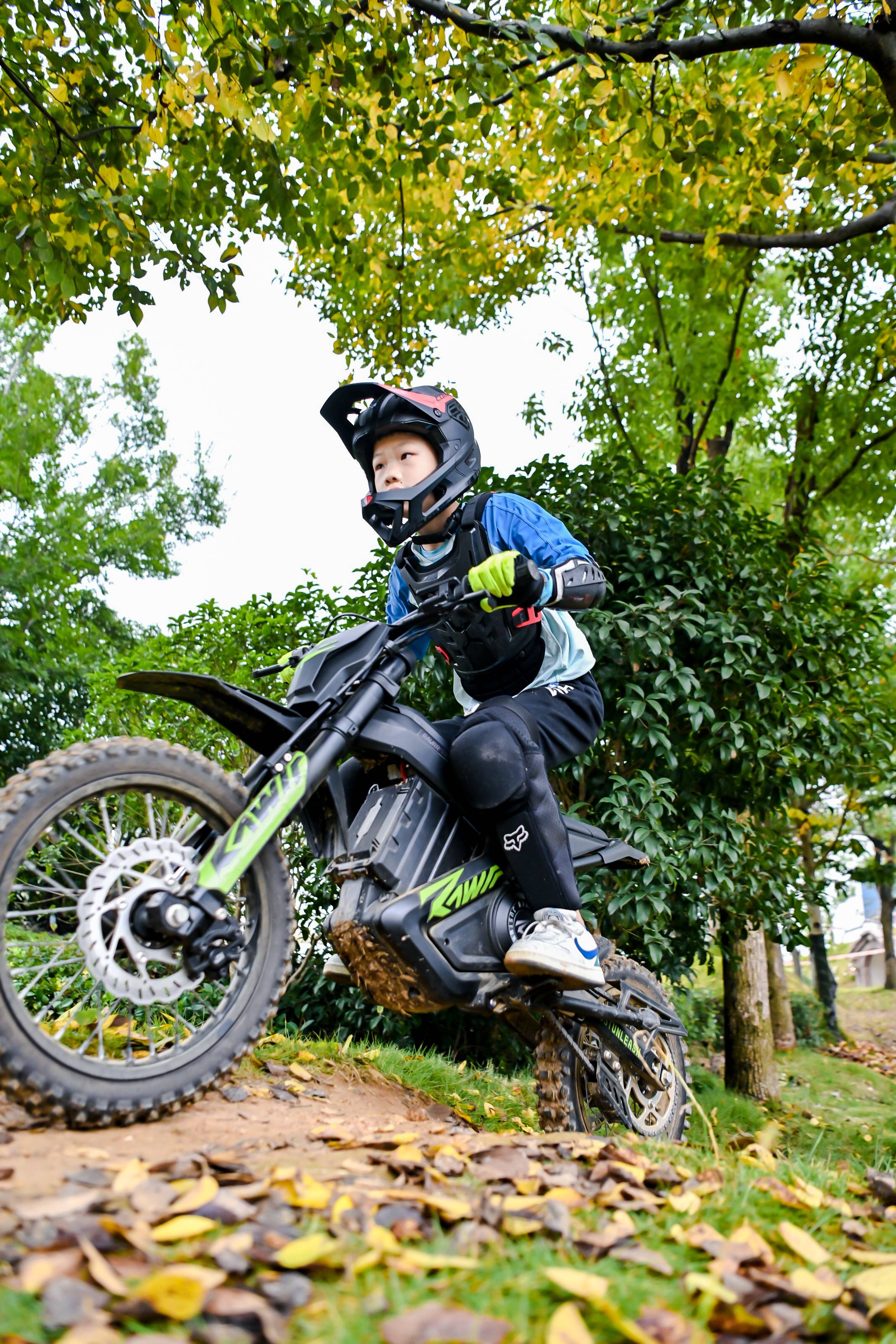 Young boy riding a mantis mini R